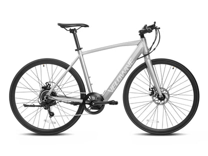 Sleek silver Velowave Spirit Electric Road Bike in urban setting, showcasing its lightweight design and advanced features for efficient city commuting.